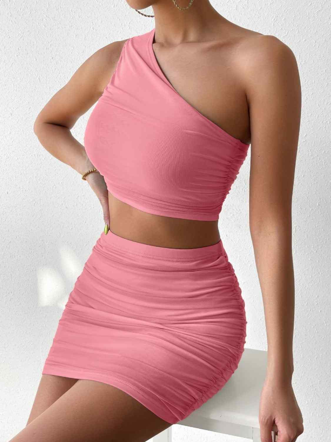 Ruched single shoulder top and skirt set in pink, highly stretchy, polyester blend.