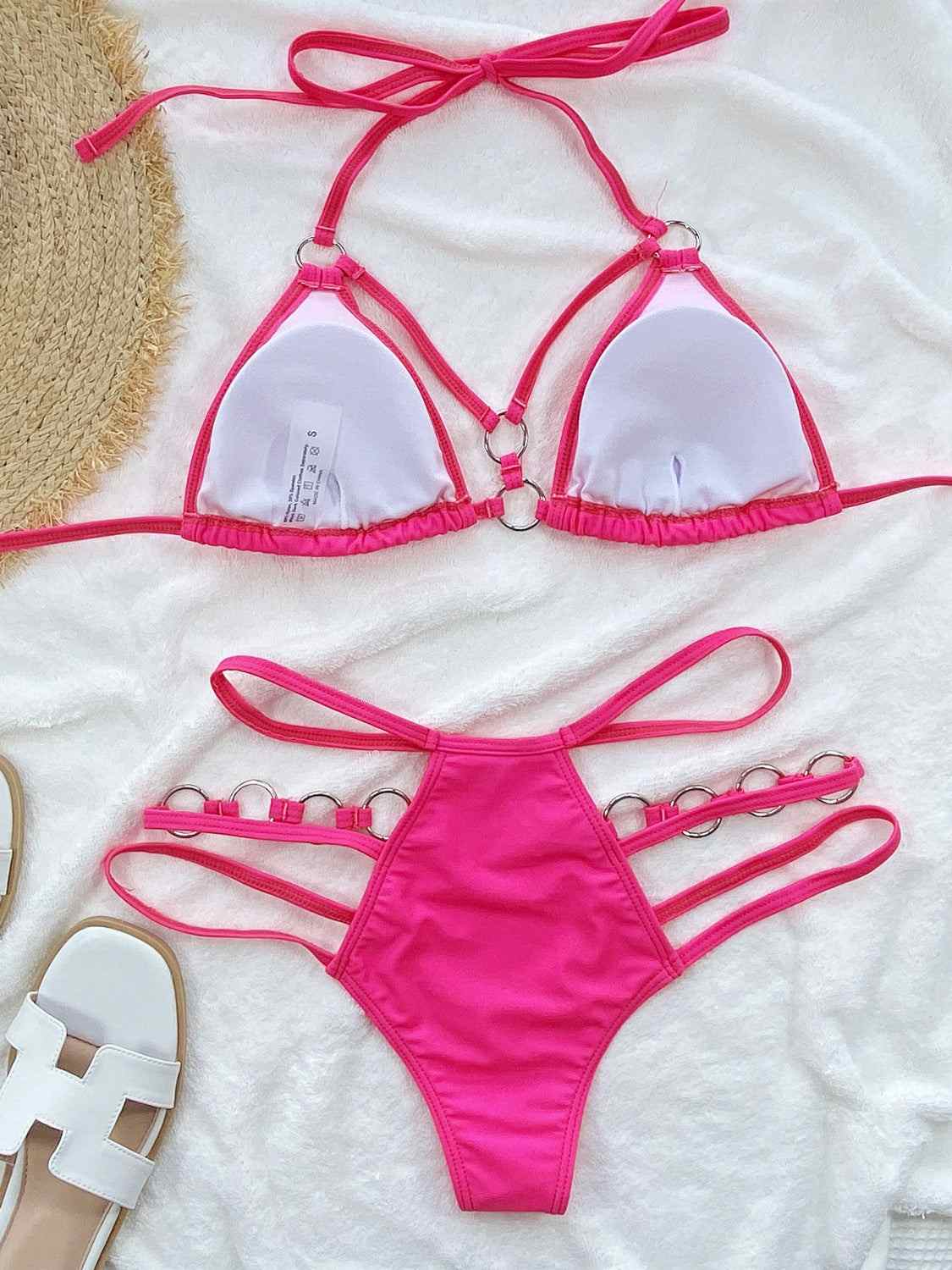 Cutout halter neck two-piece bikini set with removable padding, slightly stretchy fabric.