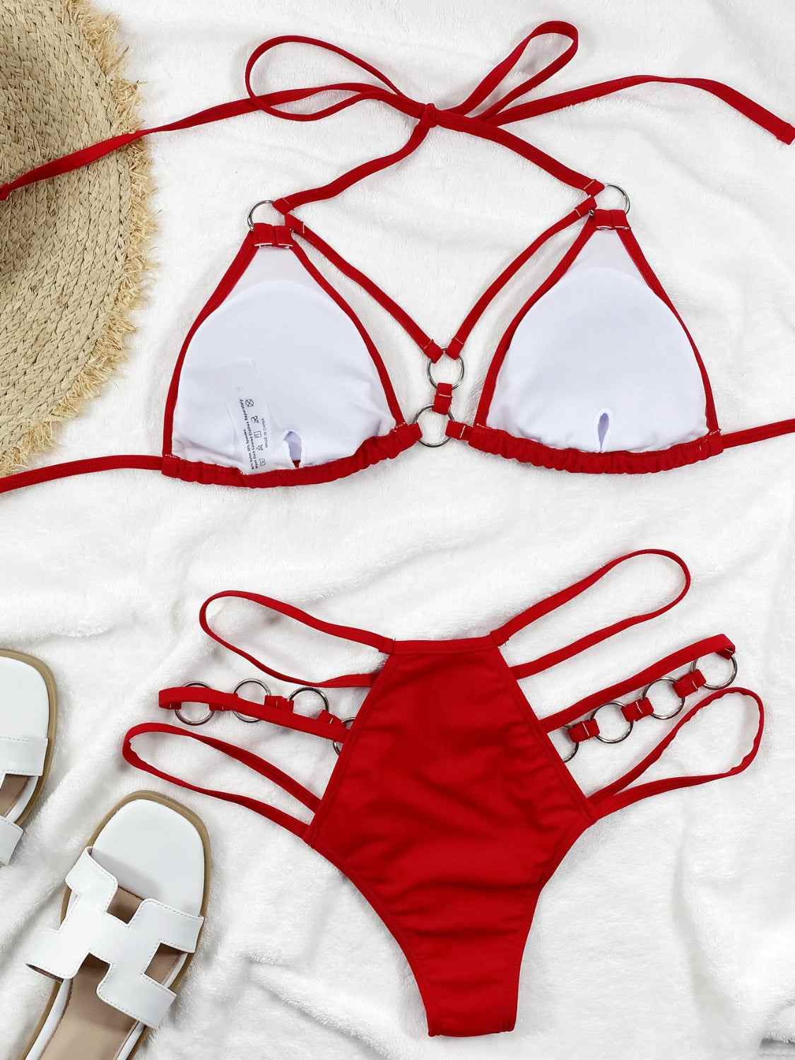 Cutout halter neck two-piece bikini set with removable padding and slightly stretchy fabric.