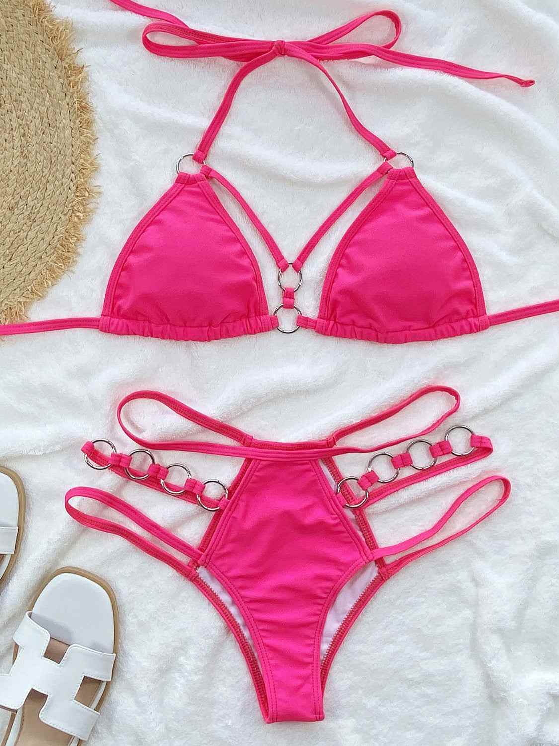 Cutout halter neck two-piece bikini set with removable padding and no underwire.