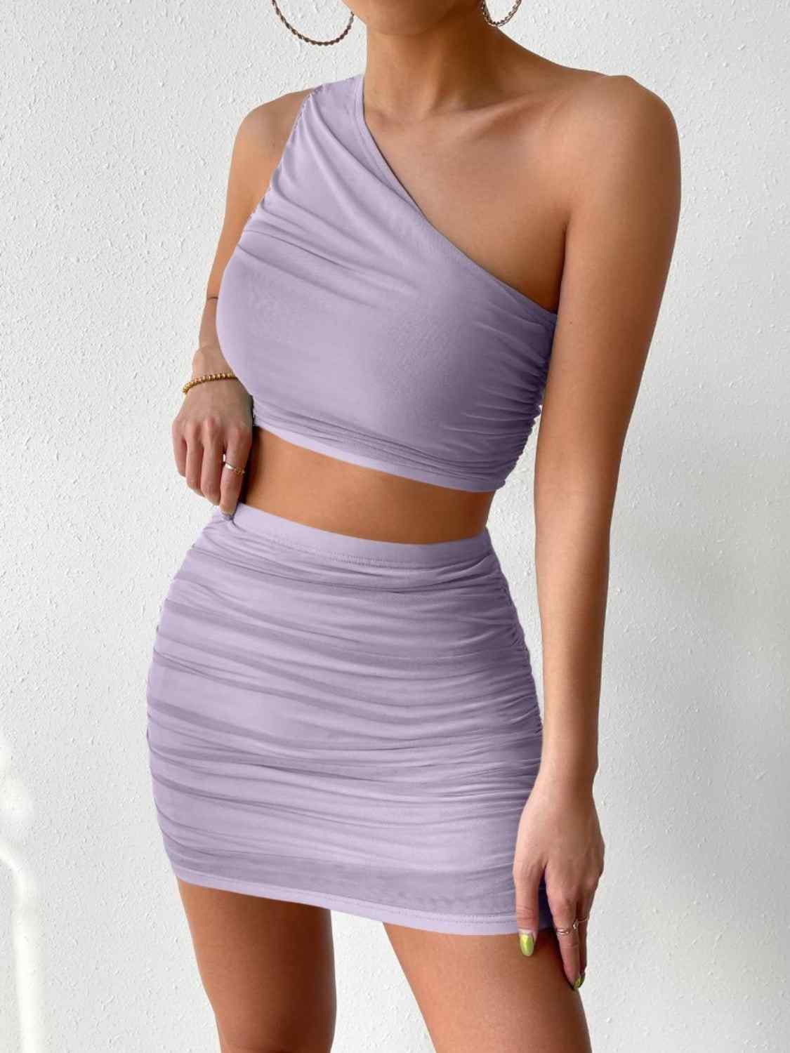 Ruched single shoulder top and skirt set in lilac, highly stretchy two-piece outfit.