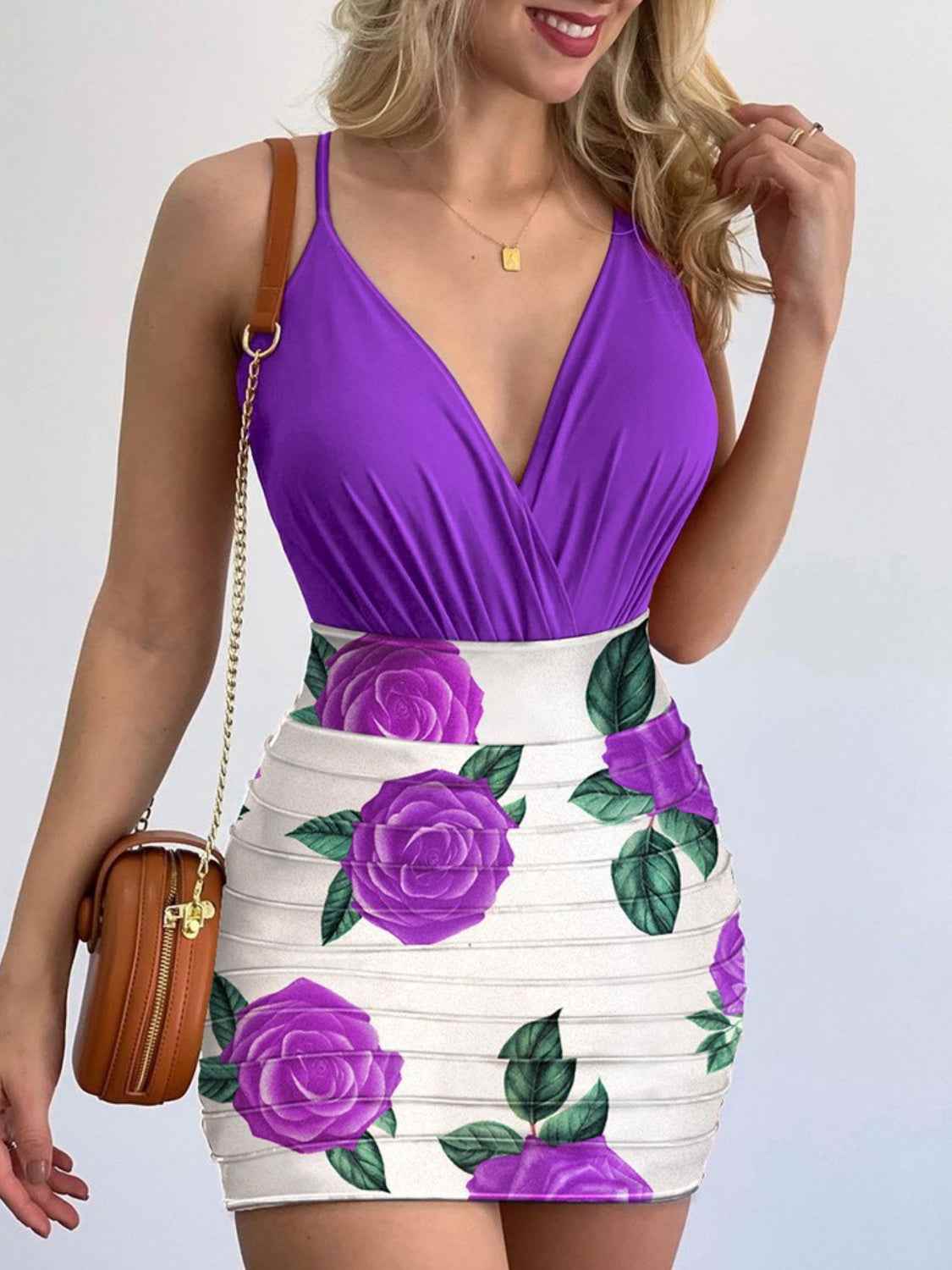 Surplice spaghetti strap top with printed mini skirt set in purple and white floral design.