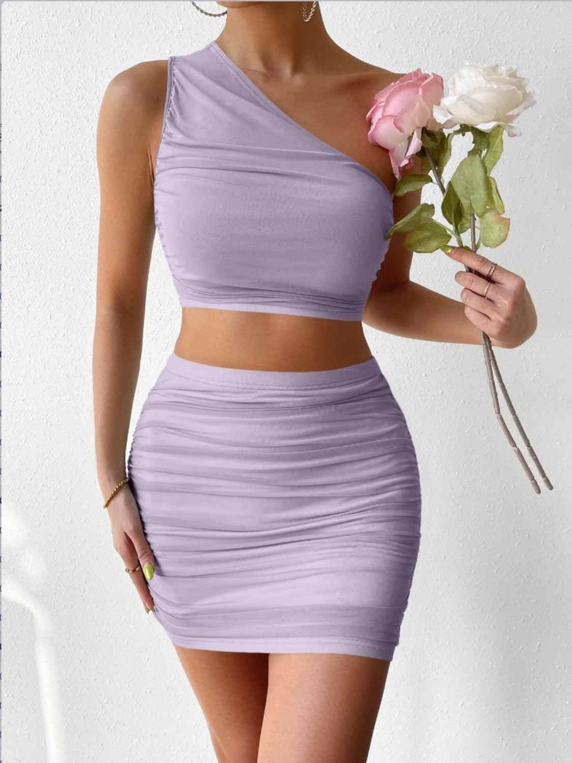 Ruched single shoulder top and skirt set in light purple, featuring a basic style with high stretch fabric.