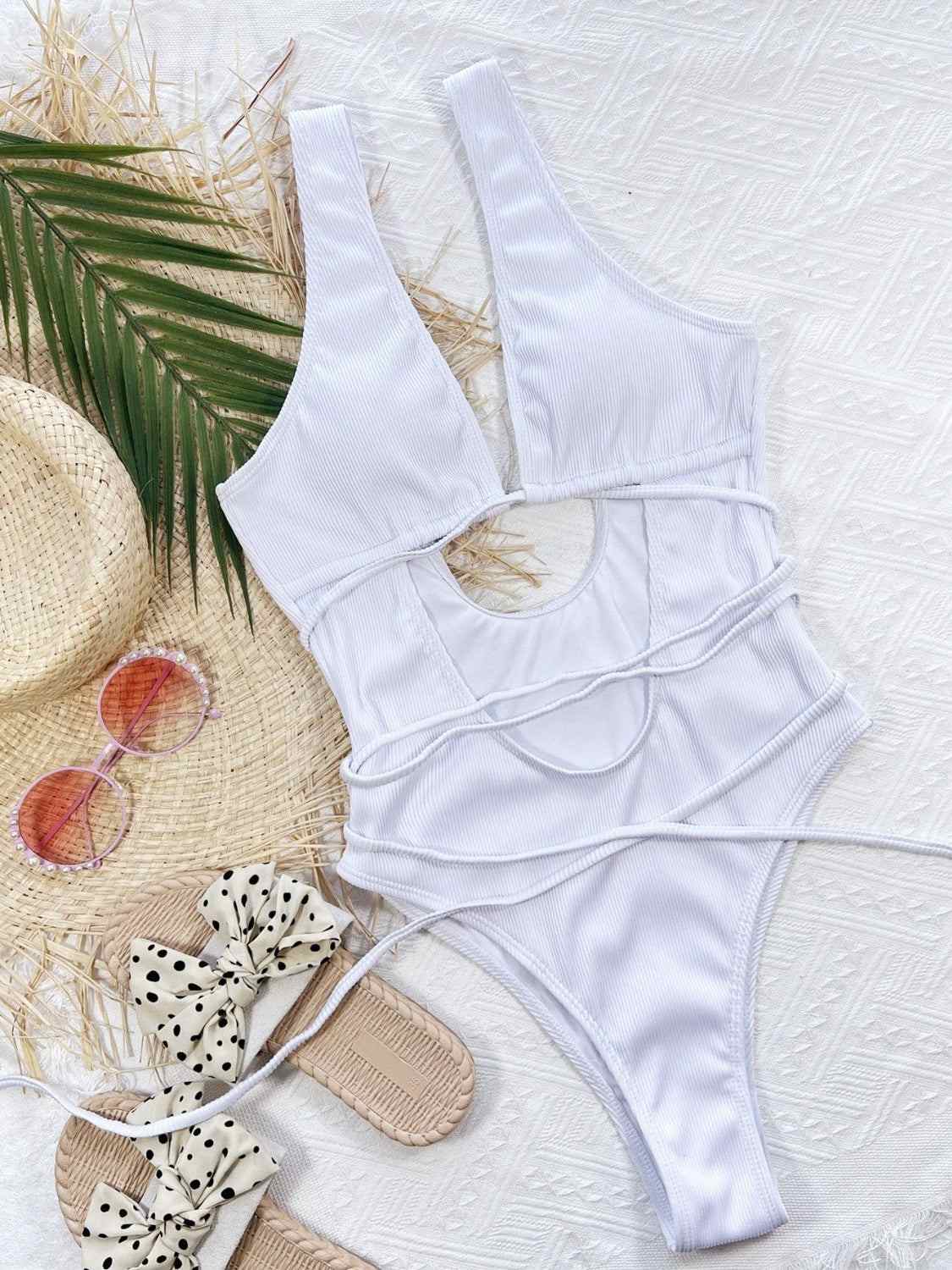 Ribbed lace-up one-piece swimsuit with removable padding, stretchy fabric, and no underwire.