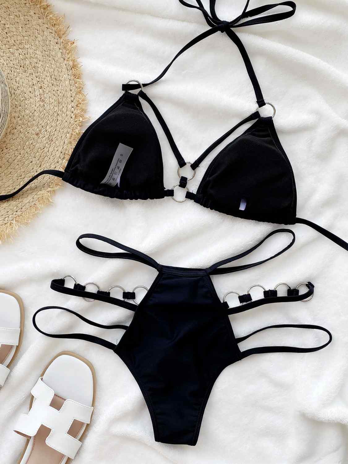 Cutout halter neck two-piece bikini set with removable padding, slightly stretchy, black color.