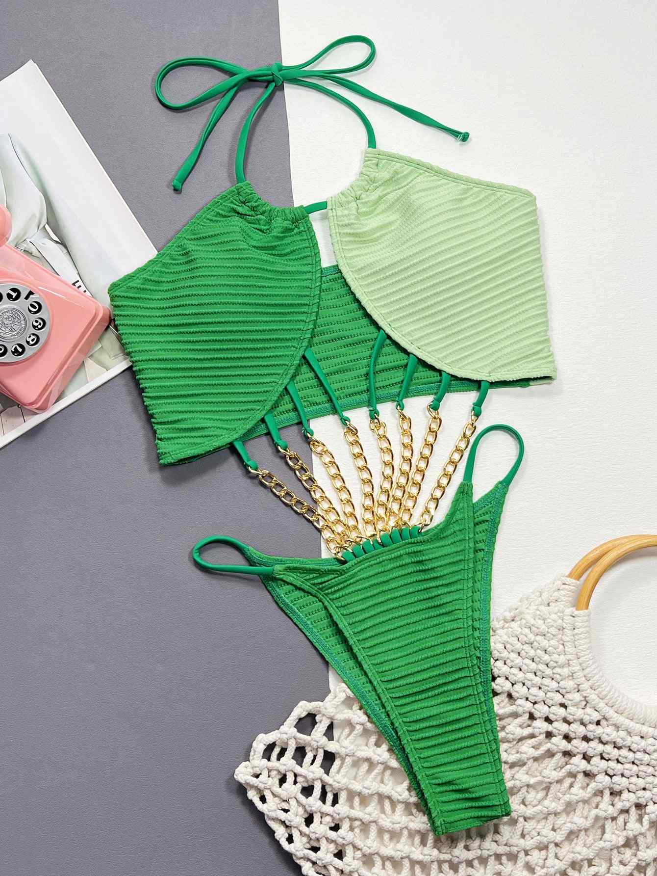 Contrast halter neck chain detail one-piece swimsuit with grommet and tie features, in green shades.