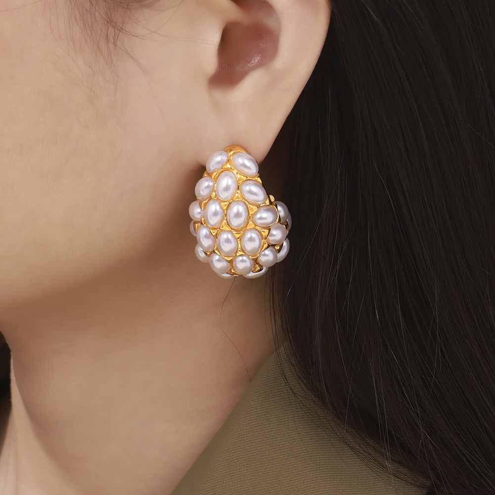 Titanium steel inlaid imitation pearl earrings with 18K gold plating.