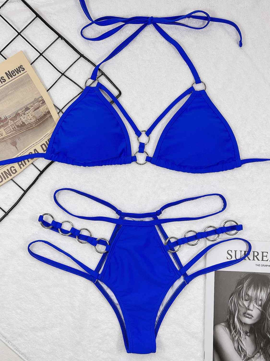 Cutout halter neck two-piece bikini set with removable padding and no underwire in vibrant blue.