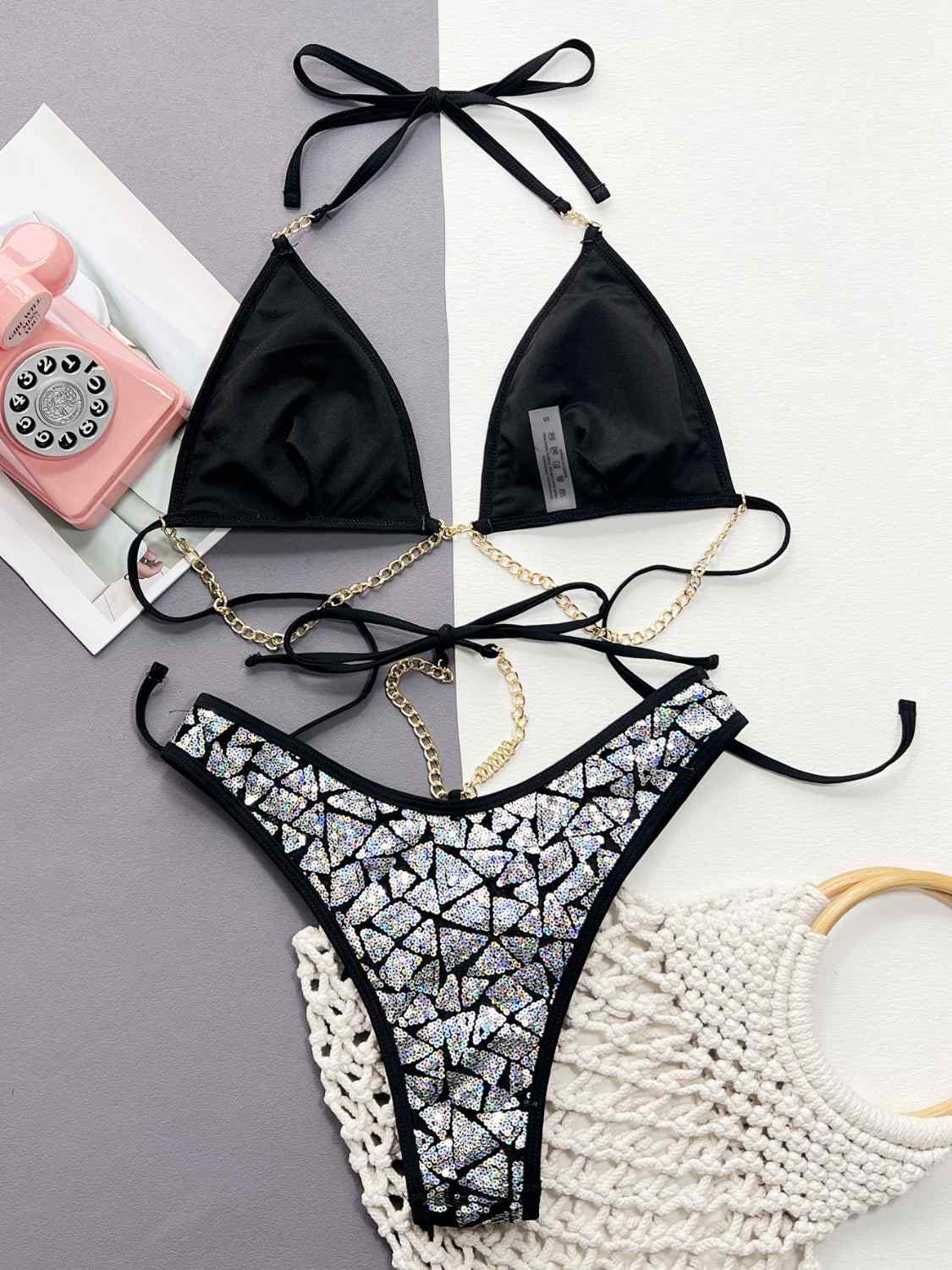 Sequin halter neck two-piece bikini set with removable padding, no underwire, black with silver sequin details.