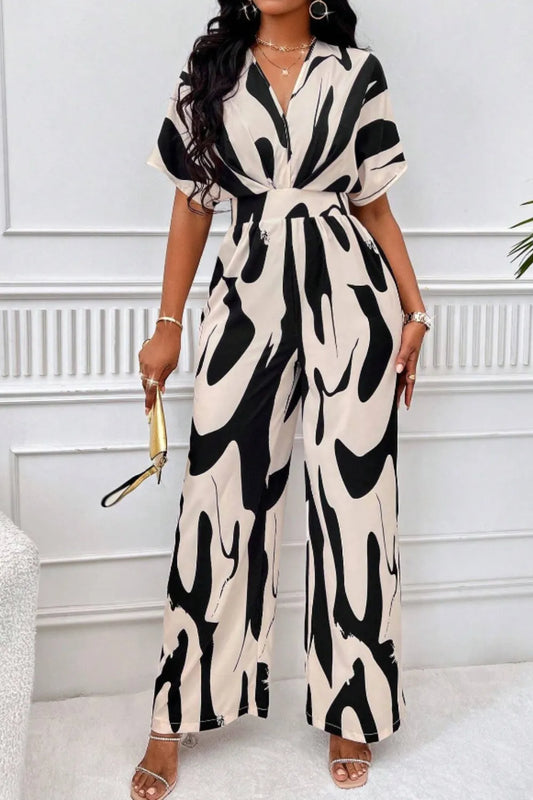 Printed V-Neck short sleeve wide leg jumpsuit in black and white pattern.