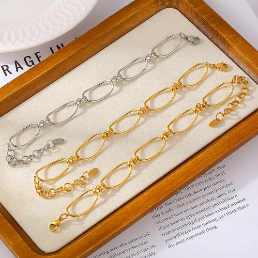 Titanium steel chain bracelet, 18K gold-plated, displayed in gold and silver color options.