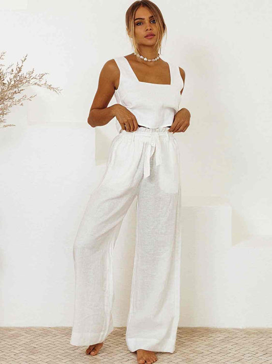 Square neck sleeveless top and pants set in white, featuring ruffled tied details, made of 100% cotton.