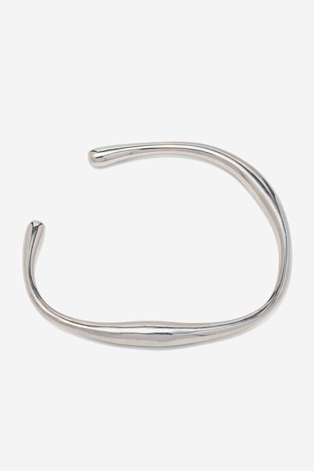 Modern stainless steel open bracelet with 18K gold-plating.