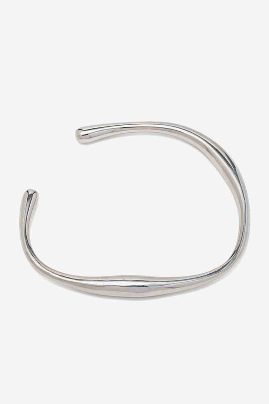 Modern stainless steel open bracelet with 18K gold-plating.