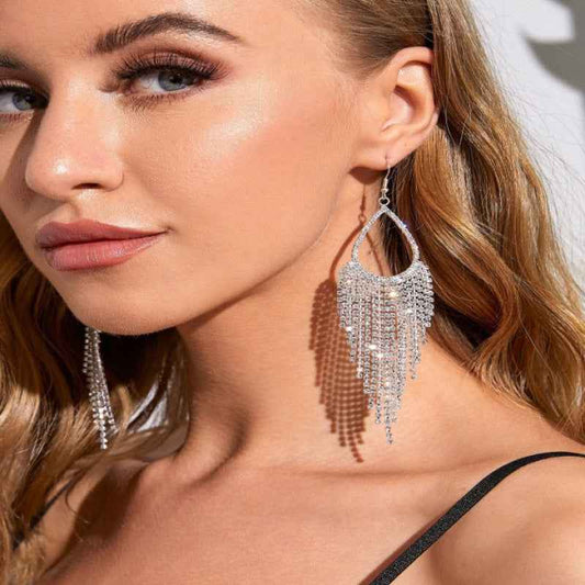 Alloy dangle earrings with intricate design, measuring 3.3x1.3 inches.