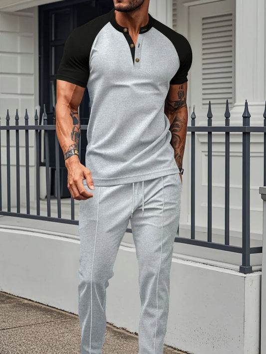 Basic waffle-knit two-piece set with buttoned top and drawstring pants.