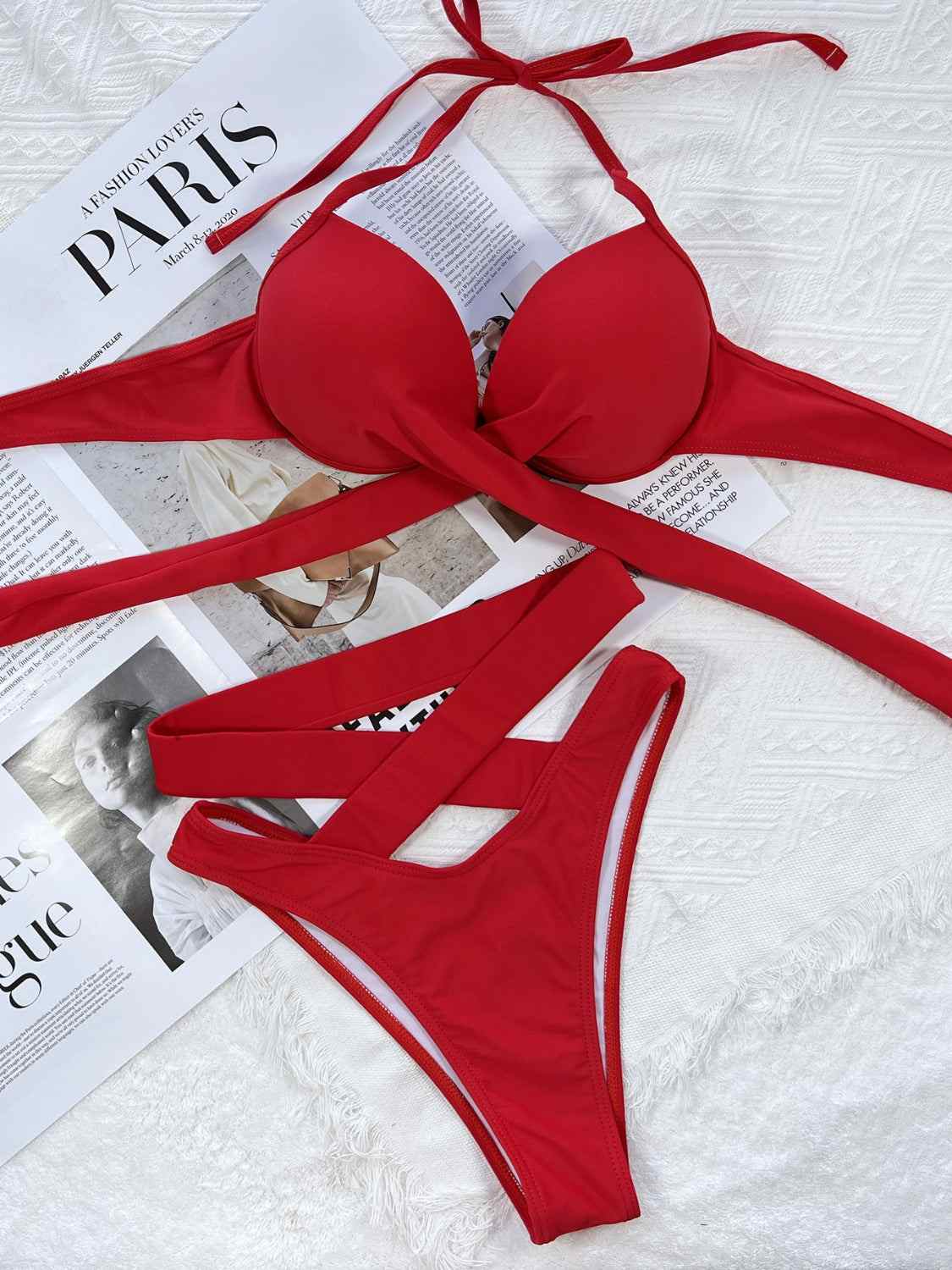 Crisscross halter neck bikini set with removable padding and ruched design.
