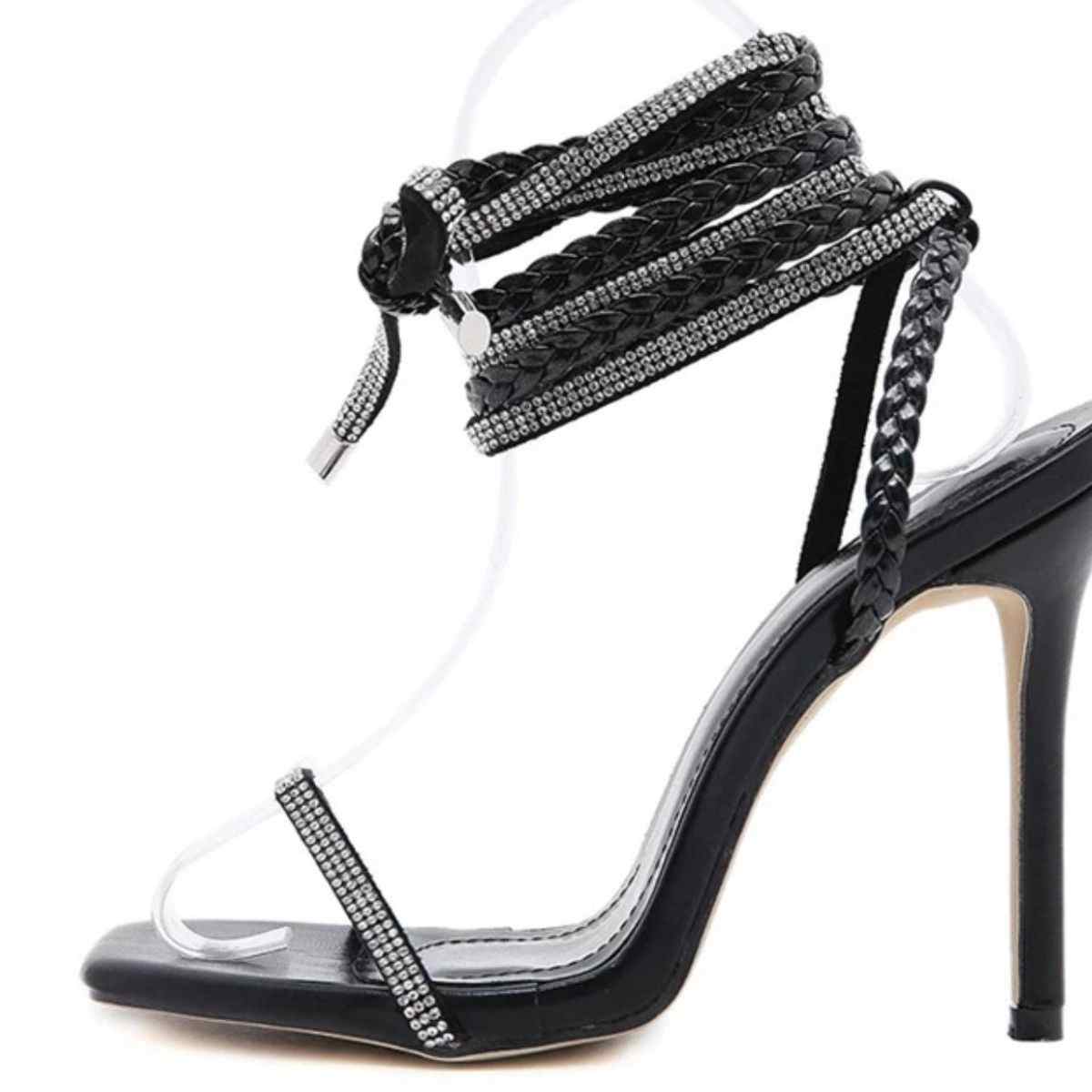 Open toe stiletto sandals with high heels and braided straps.