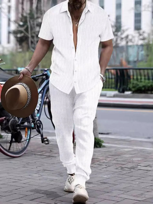 The Signature Man Set in white, two-piece outfit, slightly stretchy polyester and nylon blend, lifestyle image.