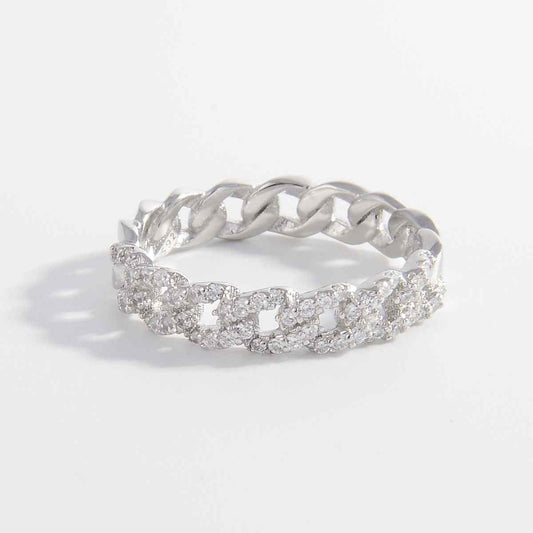 Sterling silver ring with inlaid zircon stones, platinum-plated design.