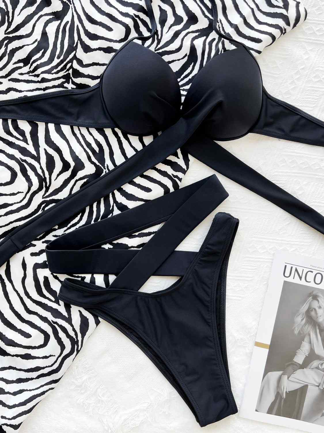 Crisscross halter neck bikini set with ruched design and removable padding.