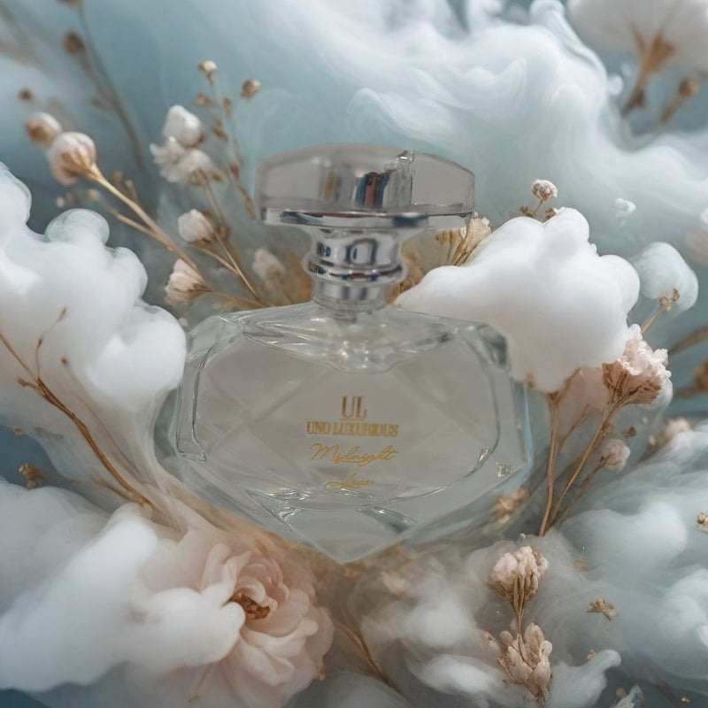 Clear perfume bottle of 'Midnight Love Scent' surrounded by ethereal flowers.
