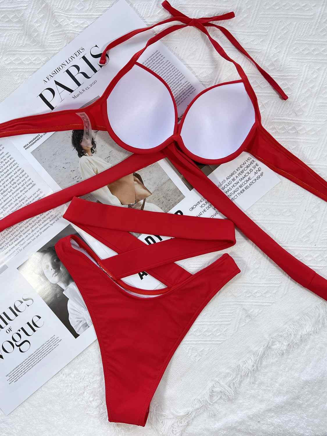 Red crisscross halter neck bikini set with removable padding; two-piece, ruched design, stretchy fabric.
